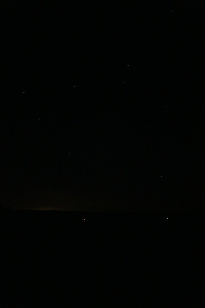 Lights on the opposite hill and stars i the night sky, Ley Farm Cottages